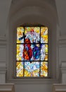 CheÃâm, Poland, 25 September 2020: Stained glass window in the window of the church, the shrine of the Mother of God in CheÃâm in